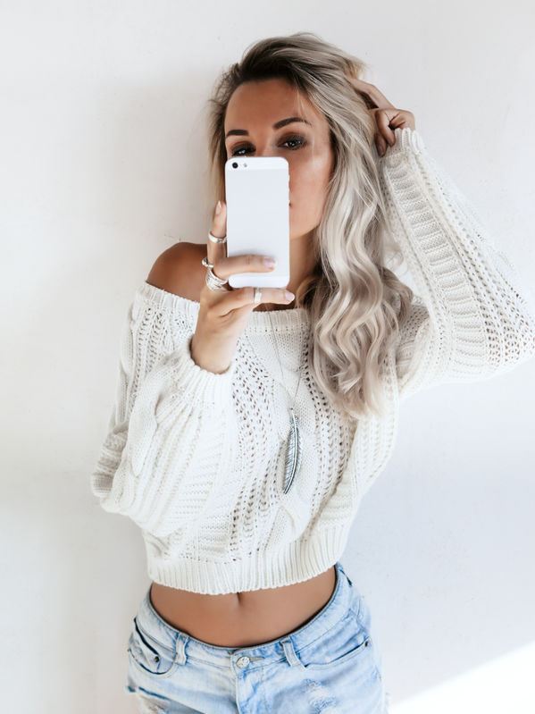 Confident woman taking selfie